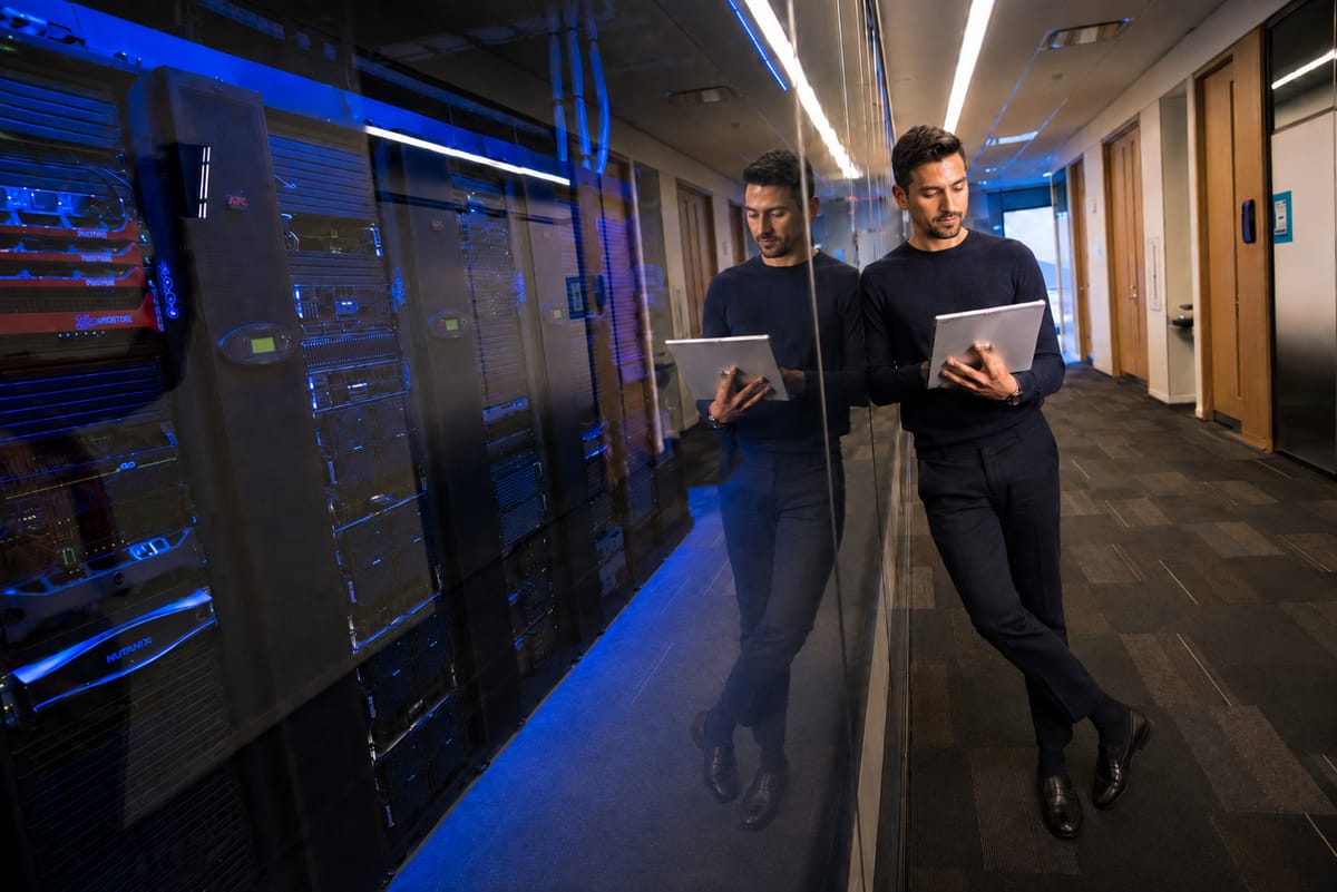 A Telebroad engineer reviewing systems in the data center